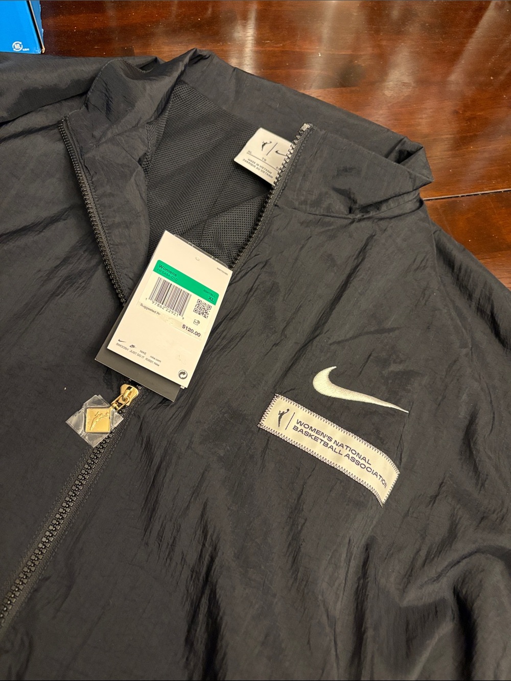 Nike Black Women's Windbreaker Jacket with White Swoosh